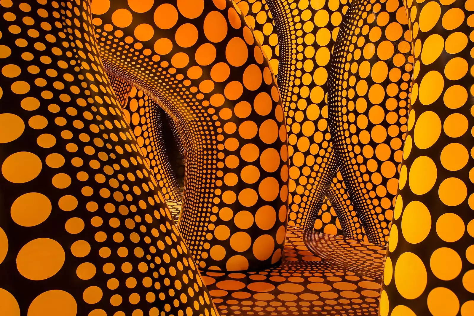 Yayoi Kusama artwork of large inflatable yellow tentacles with black polkadots on them