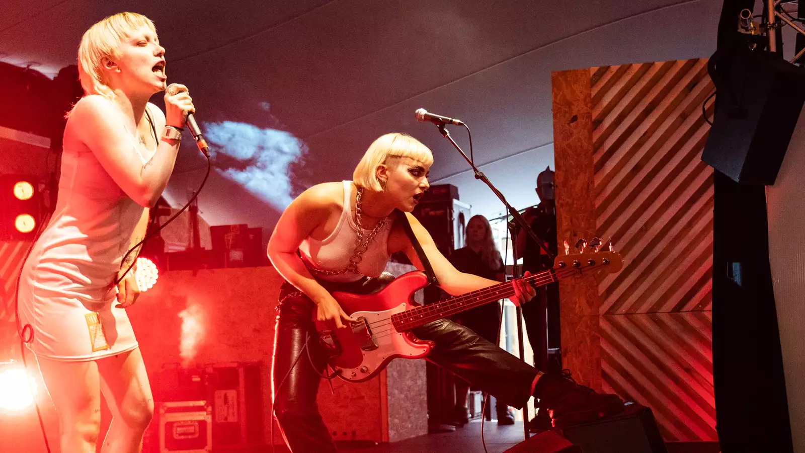 a band perfroming on stage at festival square